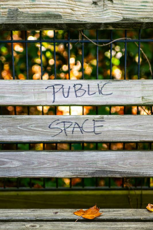 brown wooden frame with public space sign