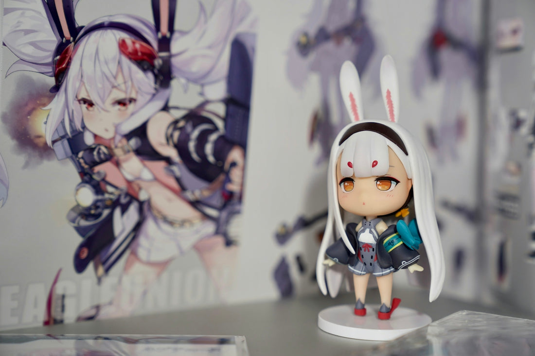 gray and white female cartoon character figurine