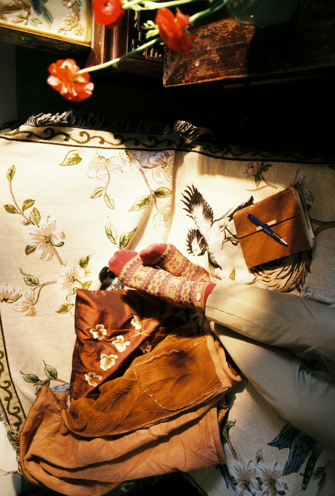 a pair of white gloves laying on top of a couch