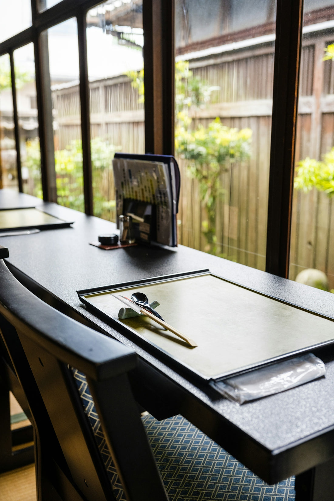 a table with a pen and a clipboard on it
