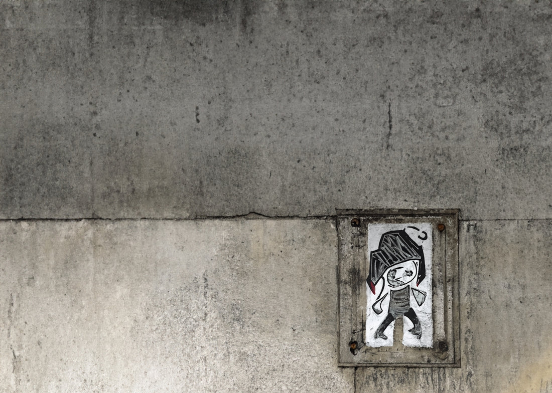 a picture of a person with a hat on a wall