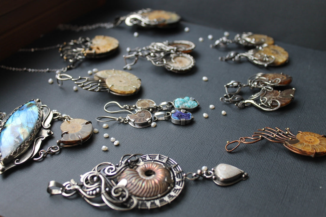 a collection of jewelry sitting on top of a table
