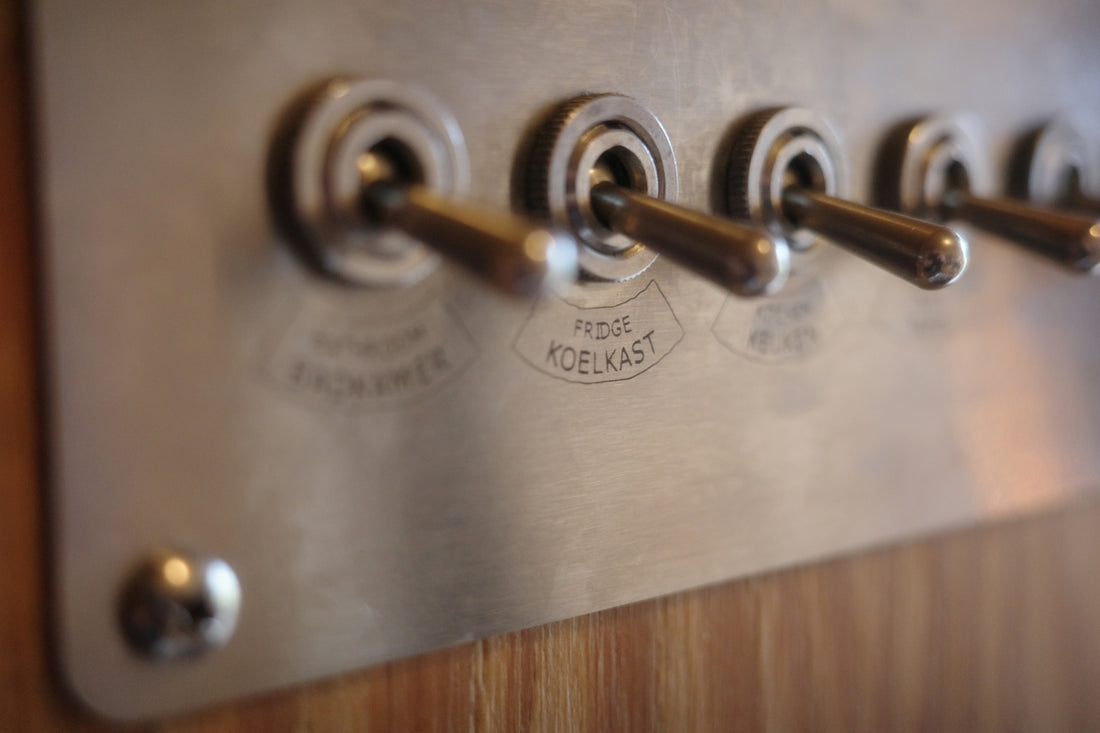 Row of vintage metal toggle light switches
